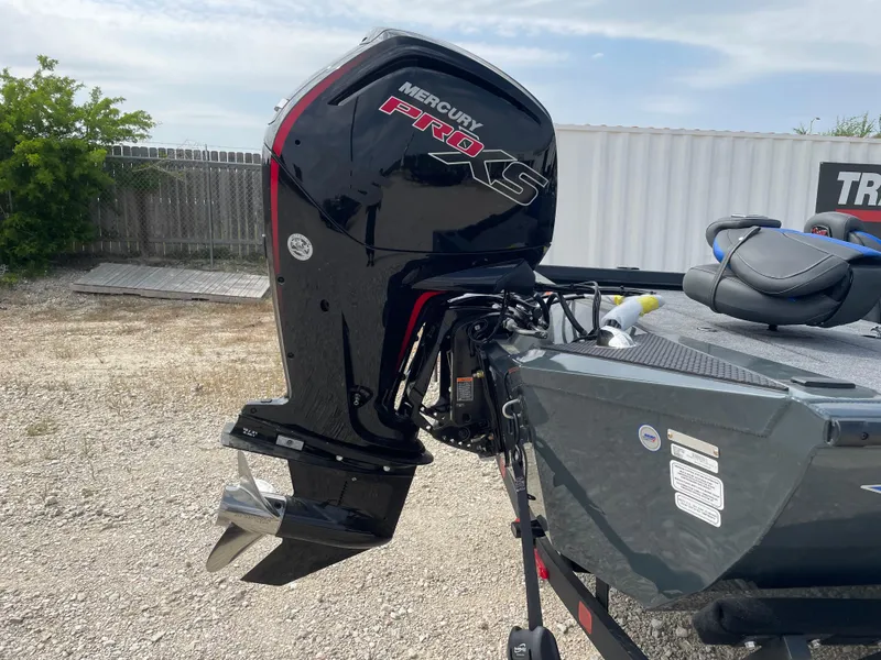 Slide: The Image of 2025 Ranger RT188P boat with Mercury Pro XS outboard motor in a yard. - 3