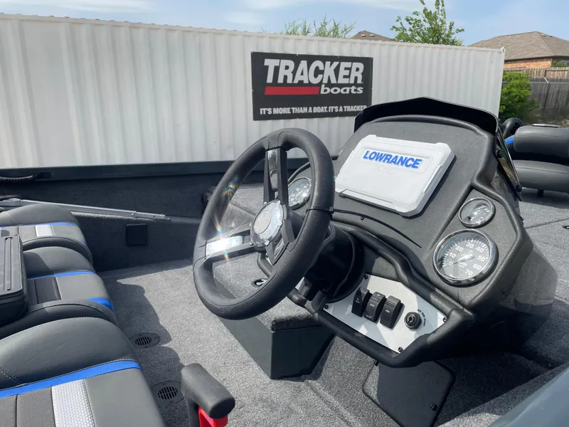 Slide: The Image of 2025 Ranger RT188P boat dashboard with Lowrance display and Tracker Boats container in background. - 8