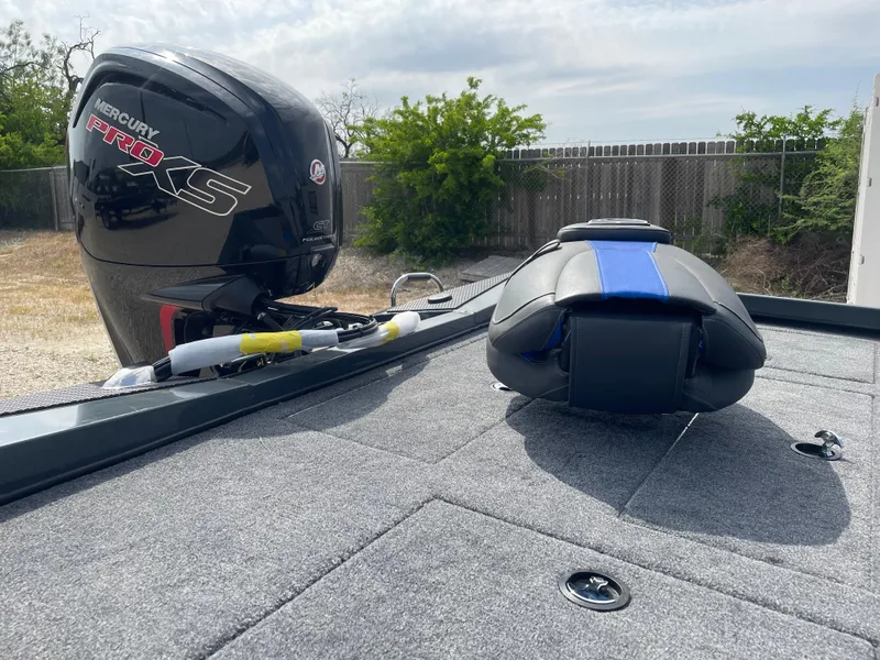 Slide: The Image of 2025 Ranger RT188P boat deck with Mercury Pro XS engine, outdoor setting. - 9