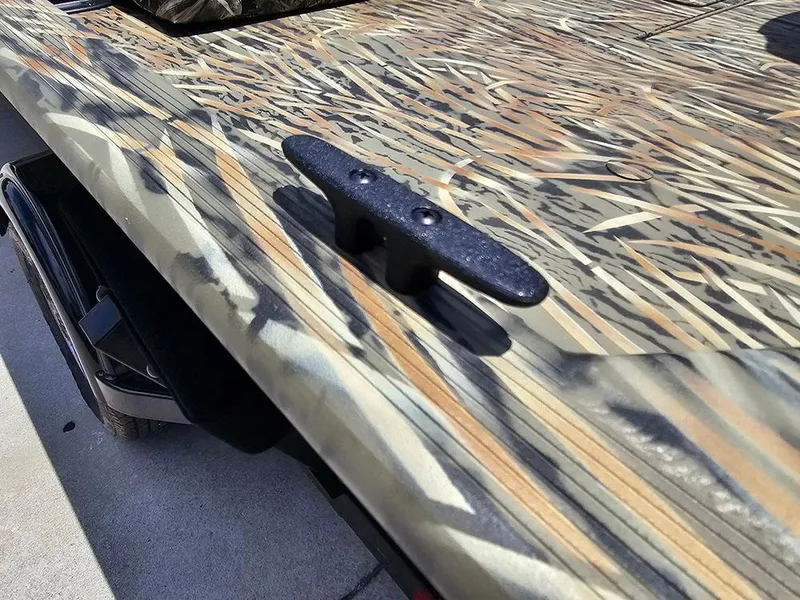 Slide: The Image of 2025 Tracker Grizzly 1860 CC boat with camouflage pattern and cleat detail. - 17