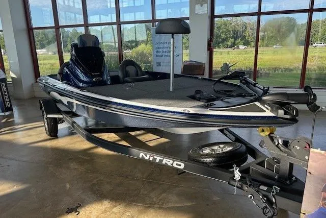 The Image of 2025 Nitro Z17 boat displayed indoors with trailer, featuring sleek design and modern features. - 0
