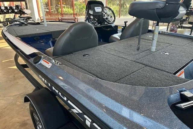 Slide: The Image of 2025 Nitro Z17 fishing boat with spacious deck and modern seating. - 2