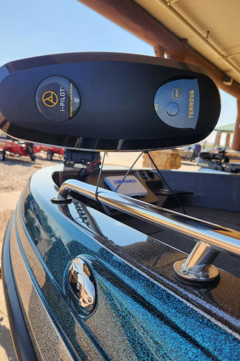 Slide: The Image of 2024 Ranger 1850MS boat with i-Pilot system, metallic finish, and chrome railings. - 2