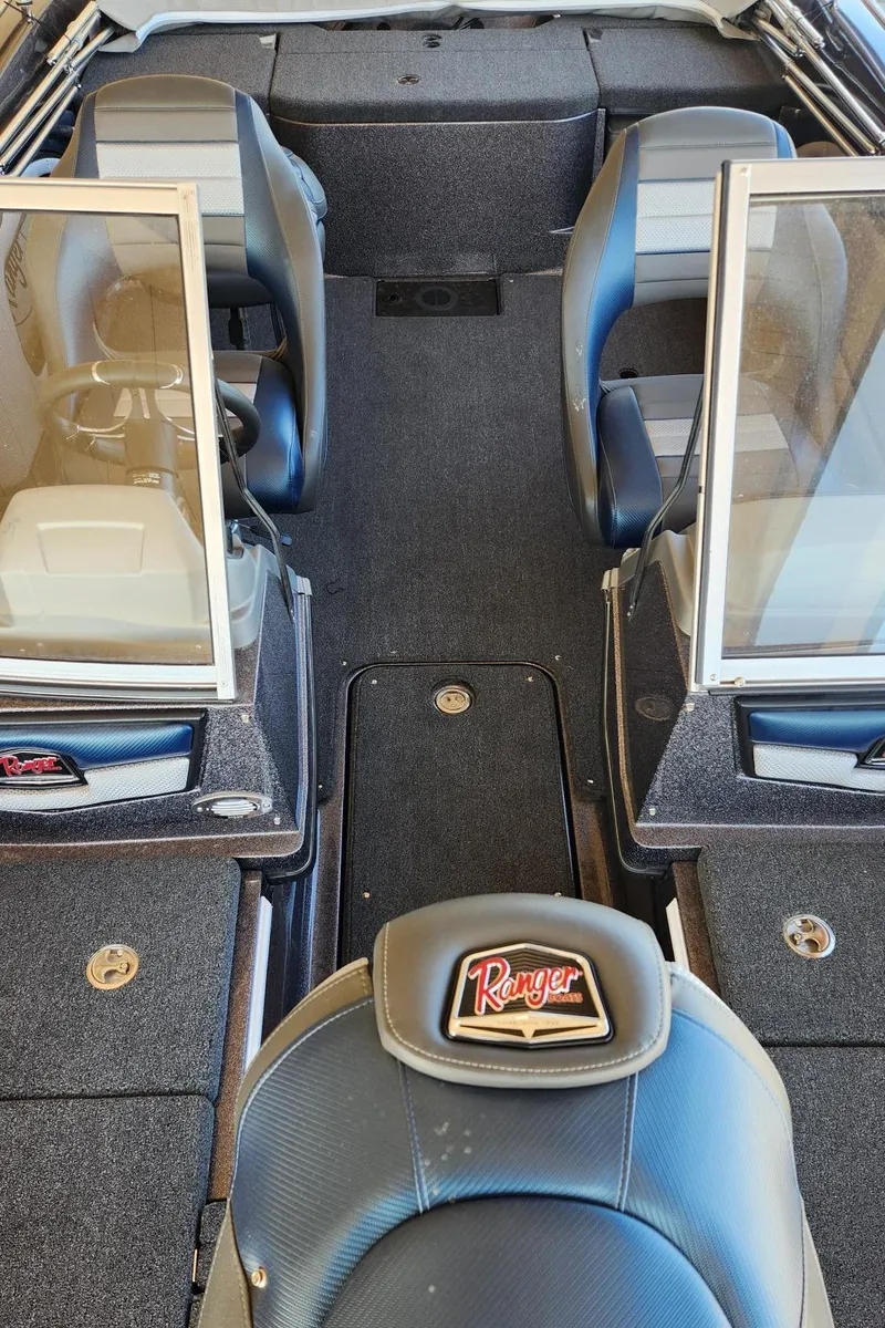 Slide: The Image of 2024 Ranger 1850MS boat interior with seating and windshield, showcasing modern design and functionality. - 5