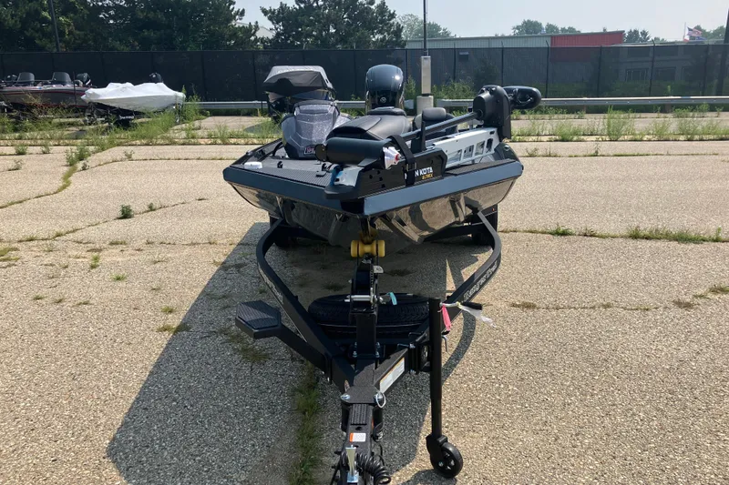 Slide: The Image of 2025 Ranger RT178 boat on trailer in parking lot, surrounded by greenery. - 3