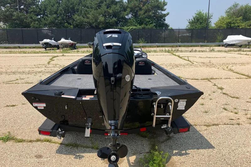 Slide: The Image of 2025 Ranger RT178 boat with Mercury 75 engine, parked on a paved lot. - 4