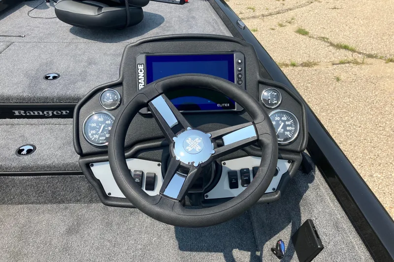 Slide: The Image of 2025 Ranger RT178 boat dashboard with steering wheel and digital display. - 5