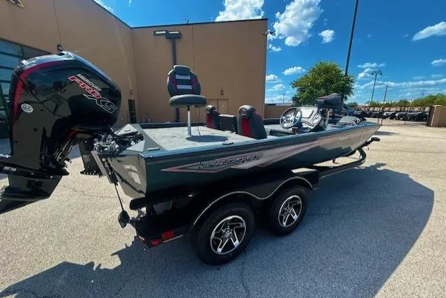 Slide: The Image of 2025 Ranger RT188P fishing boat with dual seats and powerful outboard motor. - 3