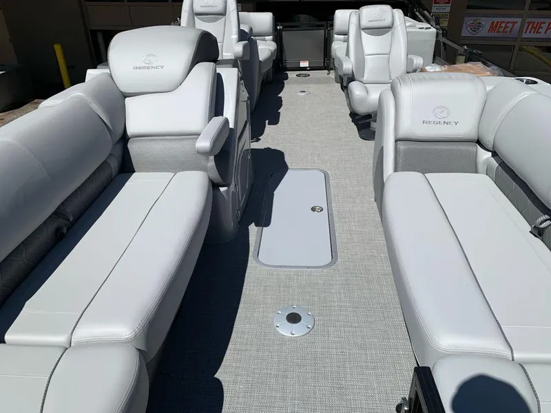 Slide: The Image of 2025 Regency 230 LE3 boat interior with luxurious white seating and spacious layout. - 5