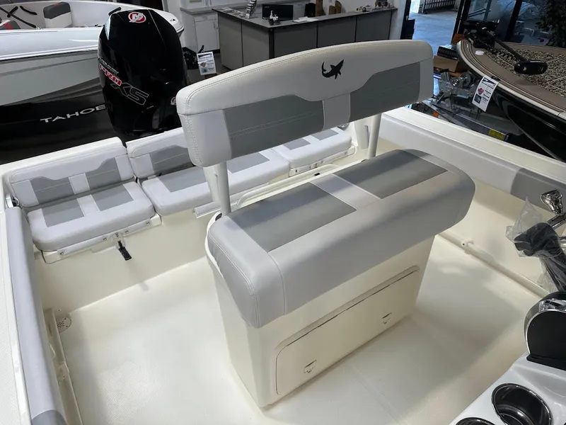 Slide: The Image of 2025 Mako 214 CC boat interior with seating and storage compartments. - 10