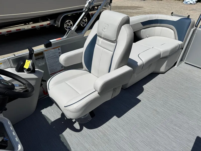 Slide: The Image of 2025 Godfrey Sweetwater 2086 SB boat interior with plush seating and modern design. - 12