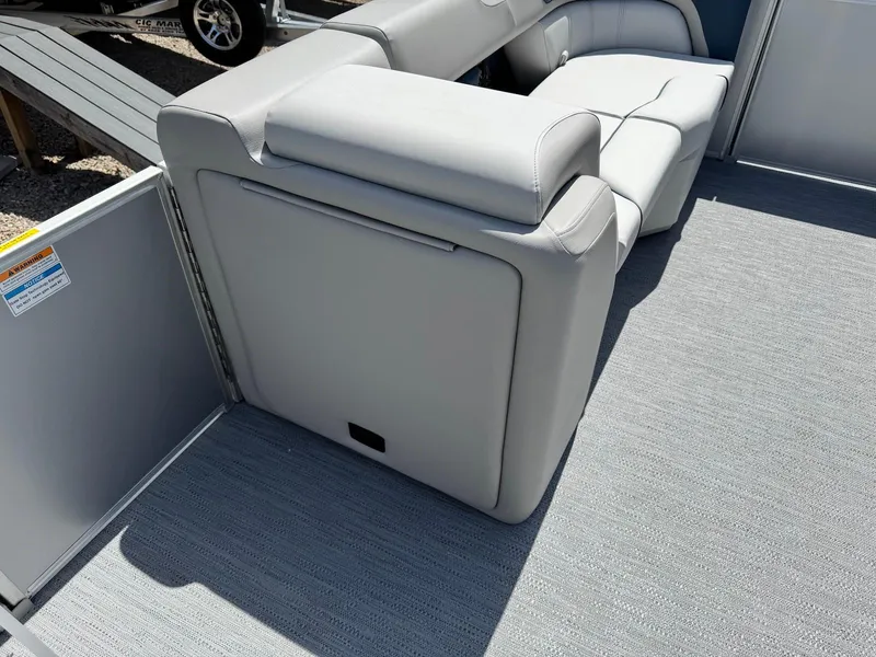 Slide: The Image of 2025 Godfrey Sweetwater 2086 SB boat interior with gray seating and flooring. - 13