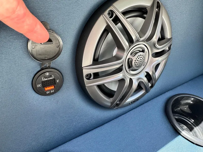 Slide: The Image of Speaker and USB port on 2025 Godfrey Sweetwater 2086 SB boat interior. - 18