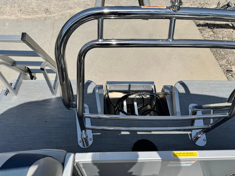 Slide: The Image of 2025 Godfrey Sweetwater 2086 SB boat deck with stainless steel railing and ladder. - 19