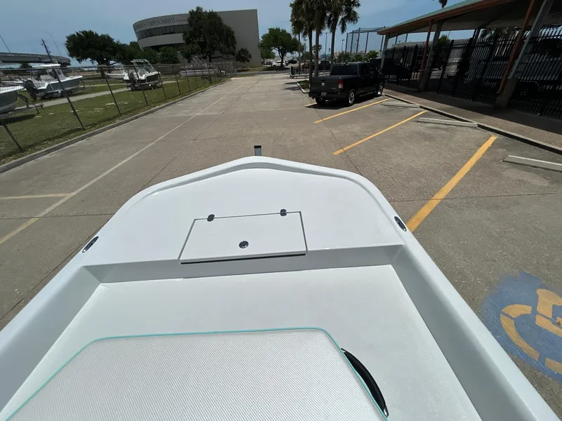 Slide: The Image of Bow view of 2025 Shallow Stalker CAT 211 PRO boat in parking lot. - 14
