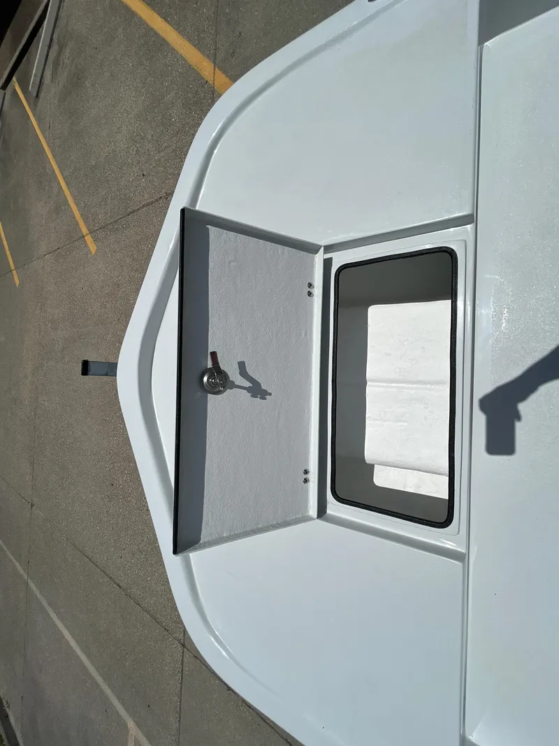 Slide: The Image of 2025 Shallow Stalker CAT 211 PRO boat hatch, open on a sunny day. - 15