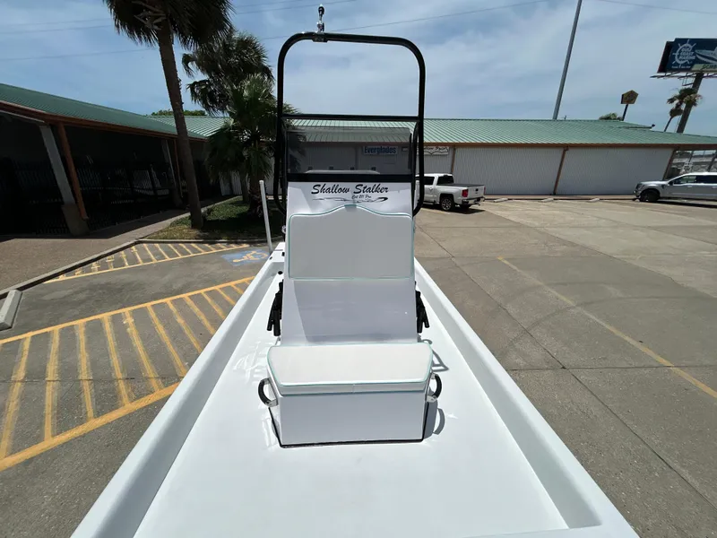 Slide: The Image of Shallow Stalker CAT 211 PRO 2025 boat in parking lot, featuring elevated seating. - 16
