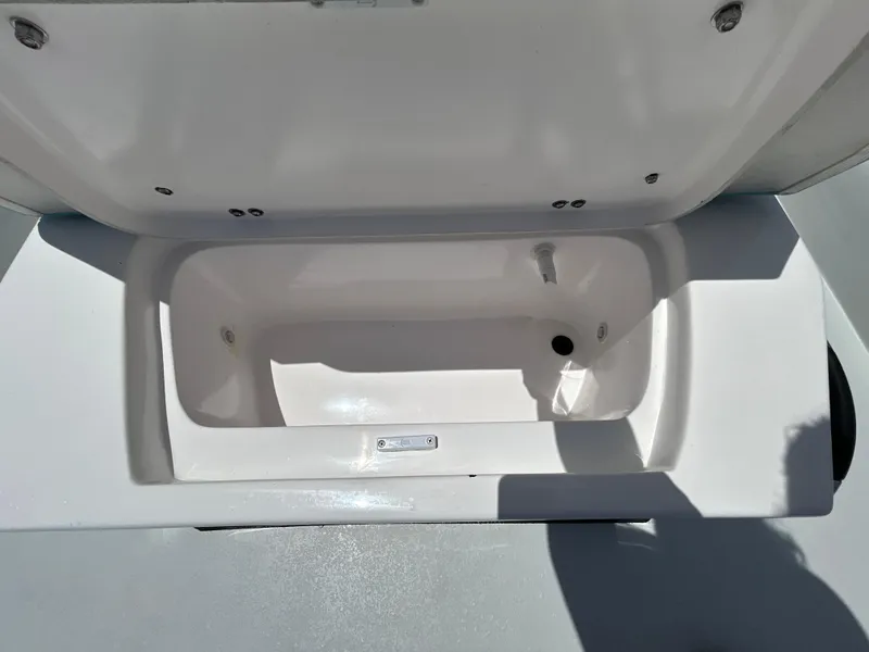 Slide: The Image of Open storage compartment in 2025 Shallow Stalker CAT 211 PRO boat. - 17