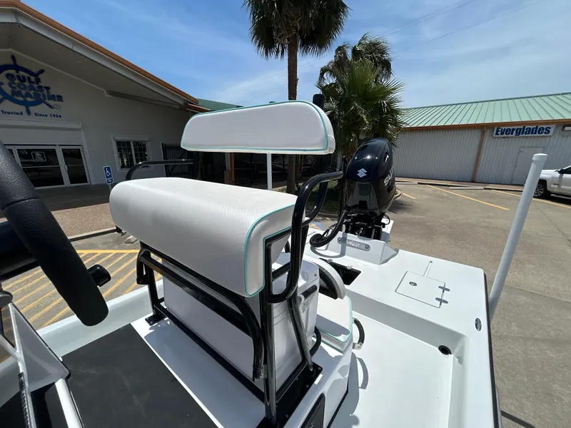 Slide: The Image of 2025 Shallow Stalker CAT 211 PRO boat with white seating and outboard motor. - 18