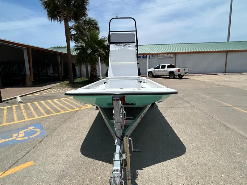 Slide: The Image of Shallow Stalker CAT 211 PRO boat, 2025 model, parked outdoors on a sunny day. - 3