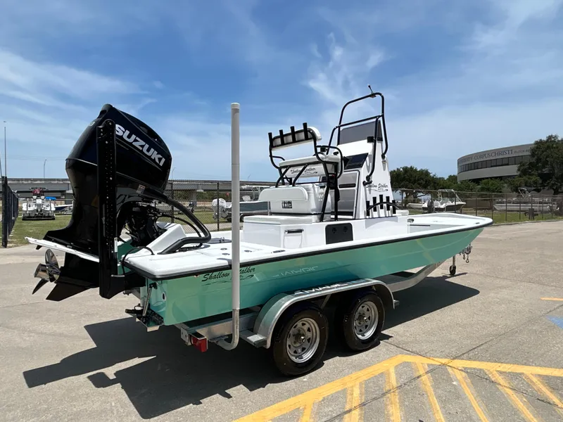 Slide: The Image of 2025 Shallow Stalker CAT 211 PRO boat on trailer, featuring Suzuki outboard motor. - 6