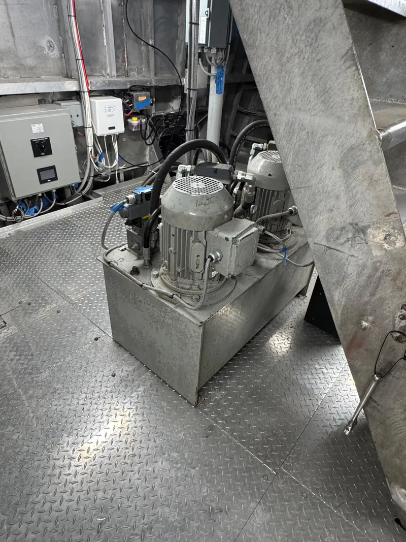 Slide: The Image of Engine room of a 1985 custom house boat with machinery and control panels. - 13