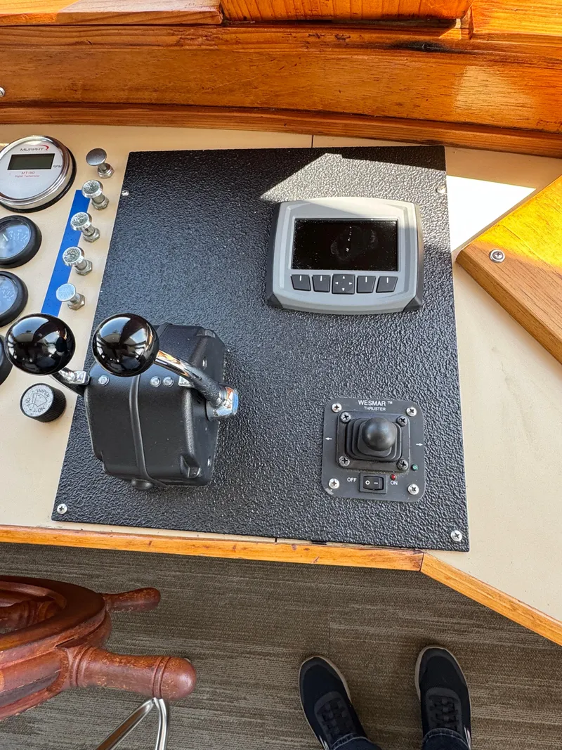 Slide: The Image of Control panel of a 1985 custom houseboat with gauges and navigation equipment. - 32