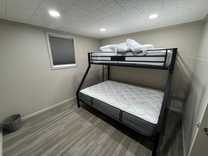 Slide: The Image of Bunk bed in a modern houseboat bedroom with wood flooring and recessed lighting. - 45
