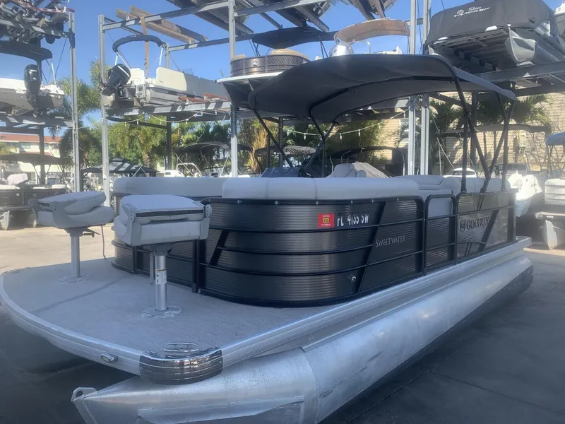 The Image of 2021 Godfrey Sweetwater 2086 BF pontoon boat with canopy, docked in a marina. - 0