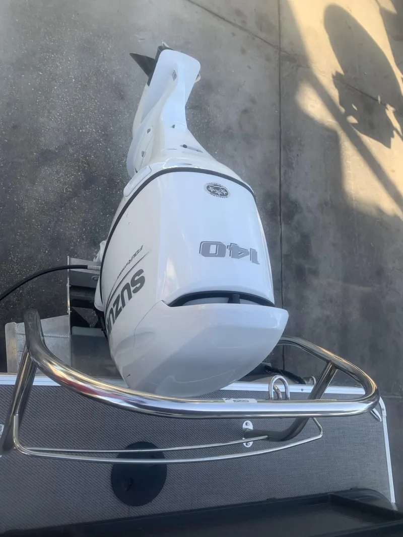 Slide: The Image of Outboard motor on a 2021 Godfrey Sweetwater 2086 BF boat, Suzuki 140 HP. - 12
