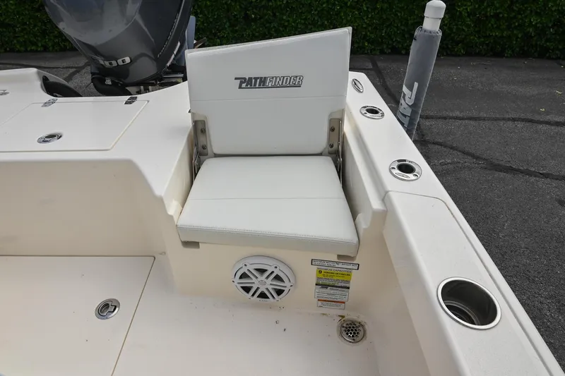 Slide: The Image of 2021 Pathfinder 2500 Hybrid boat storage compartment with open hatch and drawers. - 15