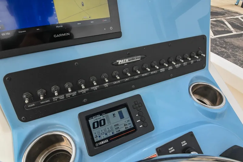 Slide: The Image of Control panel of 2021 Pathfinder 2500 Hybrid boat with steering wheel and throttle. - 24