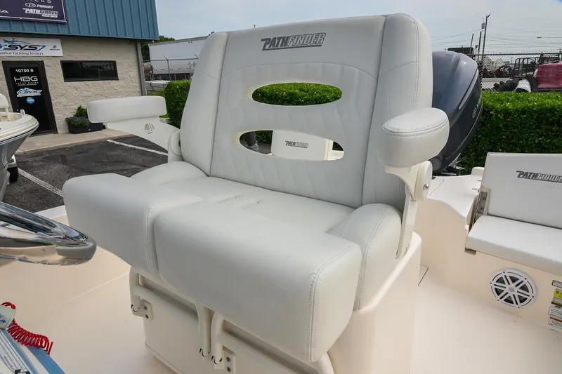 Slide: The Image of 2021 Pathfinder 2500 Hybrid boat interior with white deck and storage compartments. - 27
