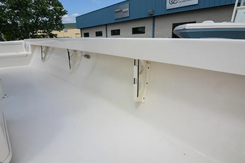 Slide: The Image of 2021 Pathfinder 2500 Hybrid boat interior, showcasing spacious deck and seating area. - 28