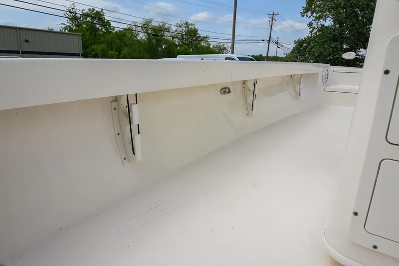 Slide: The Image of Pathfinder 2500 Hybrid boat seat with storage, 2021 model, featuring white cushioned seating. - 29