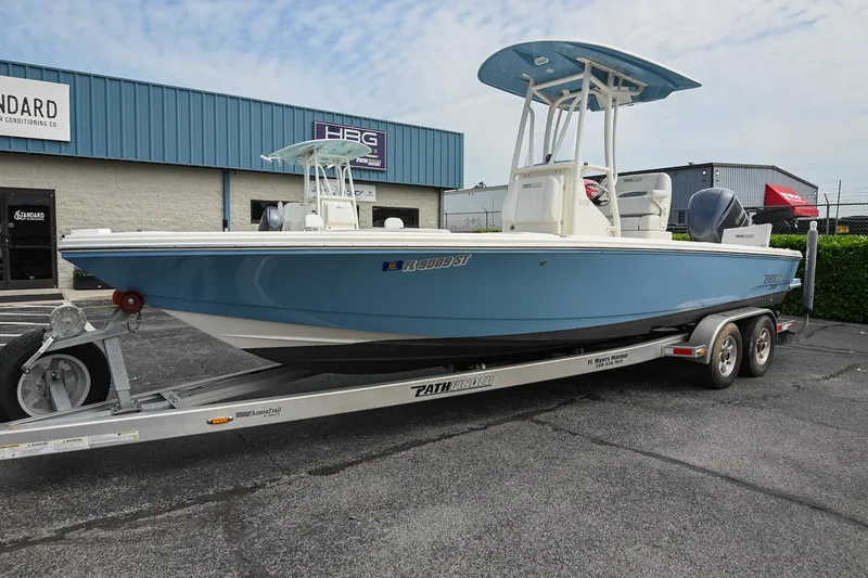 Slide: The Image of 2021 Pathfinder 2500 Hybrid boat with Yamaha 300 engine at a dock. - 3