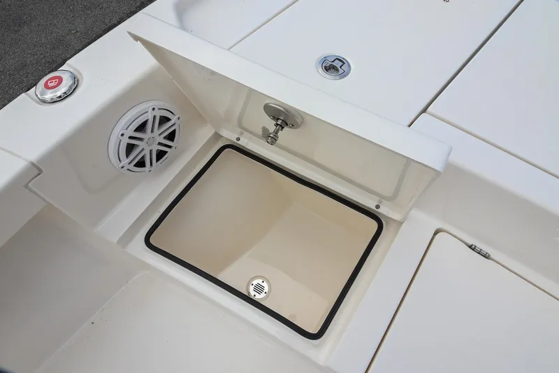 Slide: The Image of 2021 Pathfinder 2500 Hybrid boat storage compartments open, revealing gear and equipment. - 33