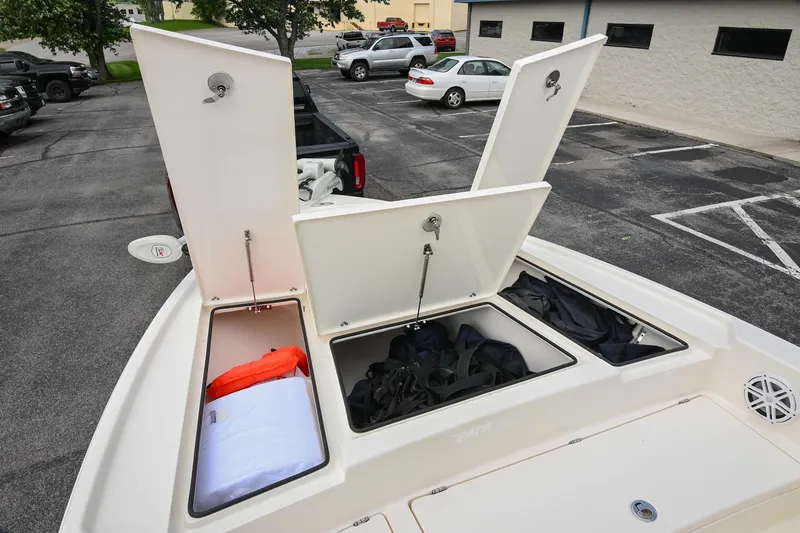 Slide: The Image of 2021 Pathfinder 2500 Hybrid boat deck with storage compartments and trolling motor. - 35