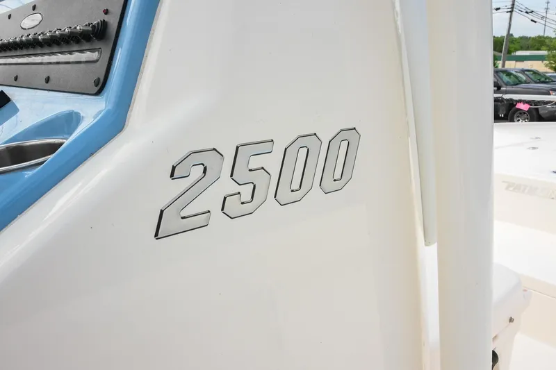 Slide: The Image of 2021 Pathfinder 2500 Hybrid boat with center console, docked outdoors. - 7