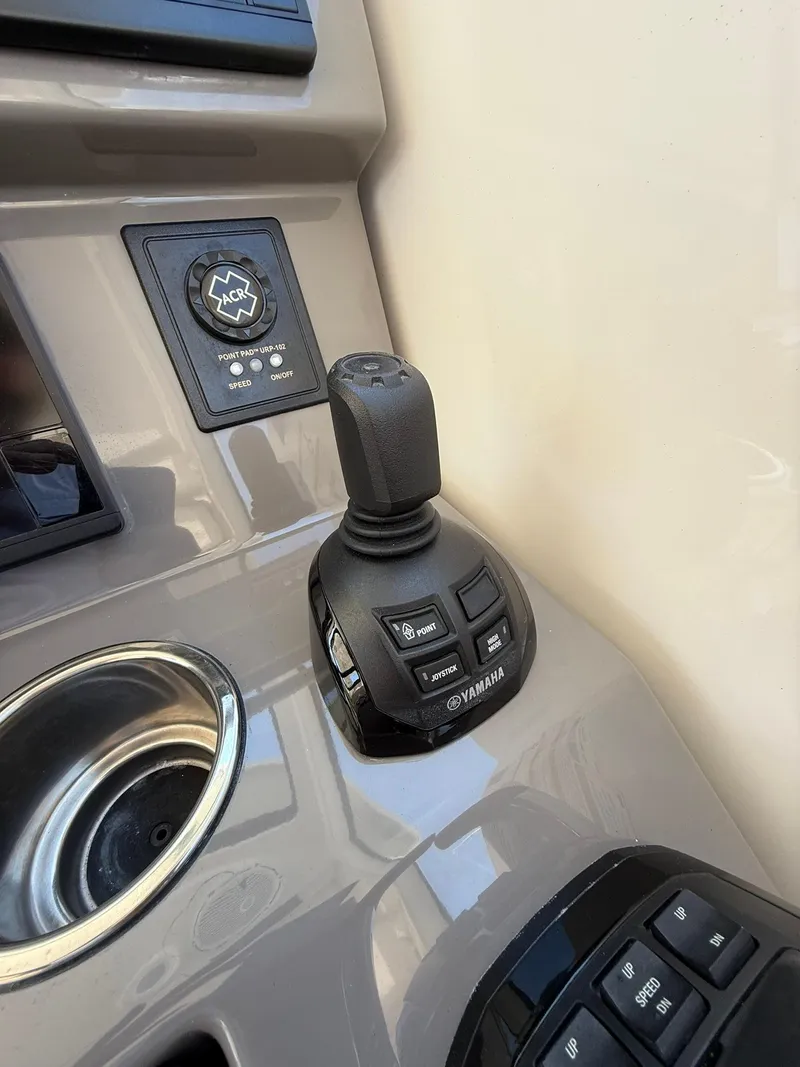 Slide: The Image of Joystick control on 2018 Pursuit DC 365 Dual Console boat dashboard. - 17