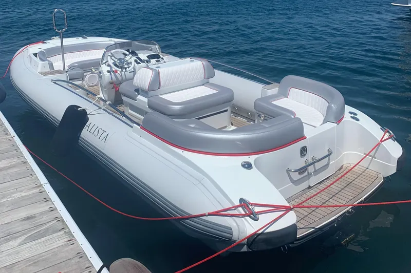 The Image of 2015 Castoldi 21 Diesel Jet Tender docked on calm water. - 0