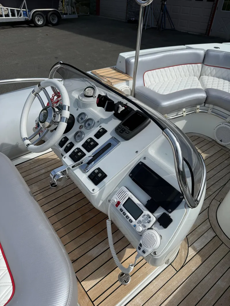 Slide: The Image of 2015 Castoldi 21 Diesel Jet Tender cockpit with modern controls and wooden deck. - 13