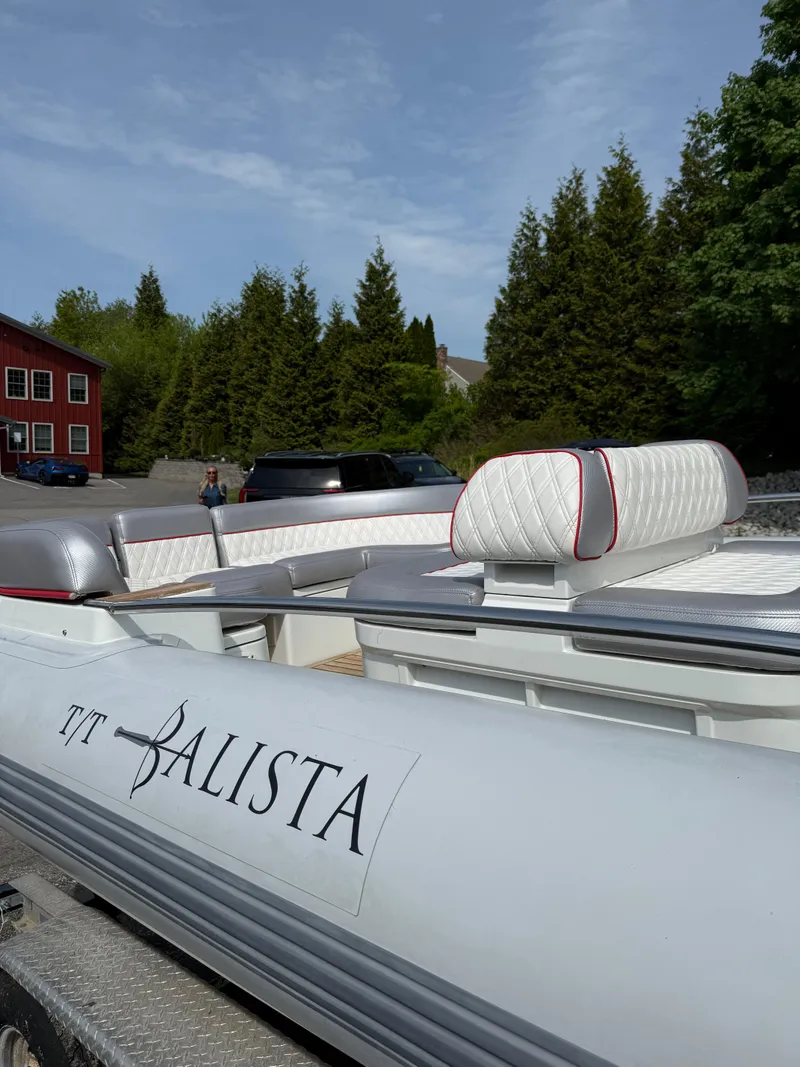 Slide: The Image of 2015 Castoldi 21 Diesel Jet Tender with white and red seating, parked outdoors. - 16