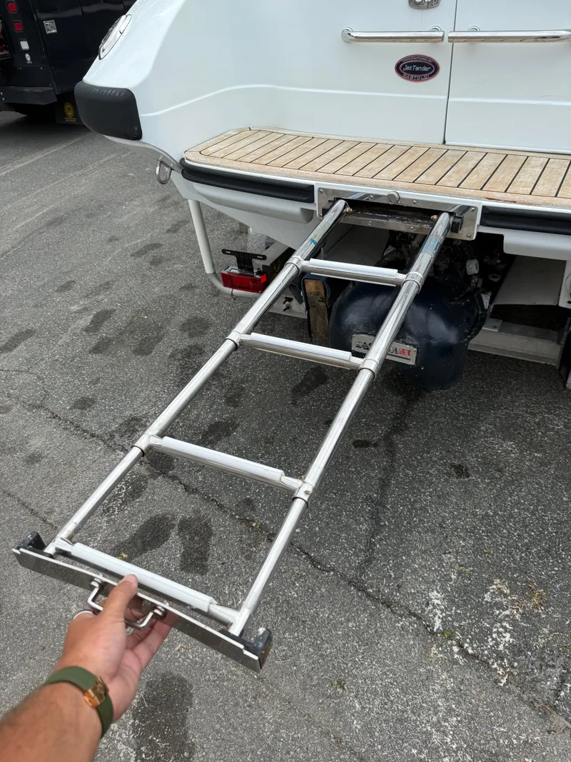 Slide: The Image of Castoldi 21 Diesel Jet Tender 2015 with extended boarding ladder on a dock. - 24