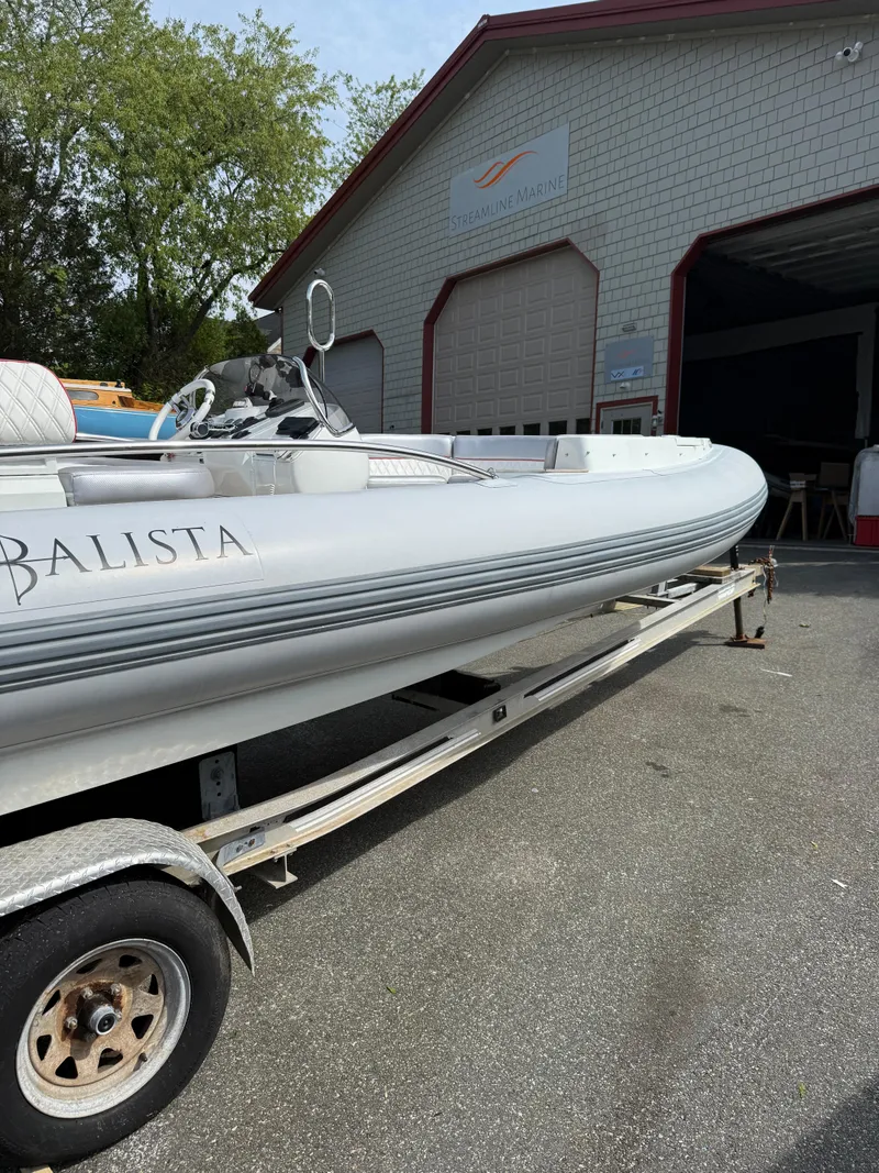 Slide: The Image of 2015 Castoldi 21 Diesel Jet Tender on trailer outside a garage. - 26