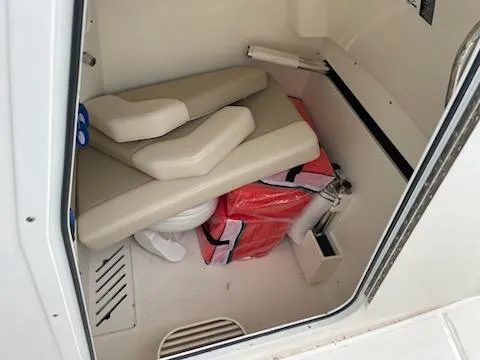 Slide: The Image of Interior of 2022 Boston Whaler 280 Outrage boat, featuring storage and seating area. - 15