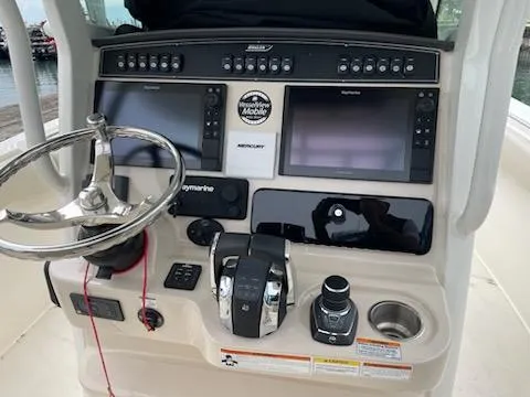 Slide: The Image of 2022 Boston Whaler 280 Outrage helm with advanced navigation and control systems. - 5