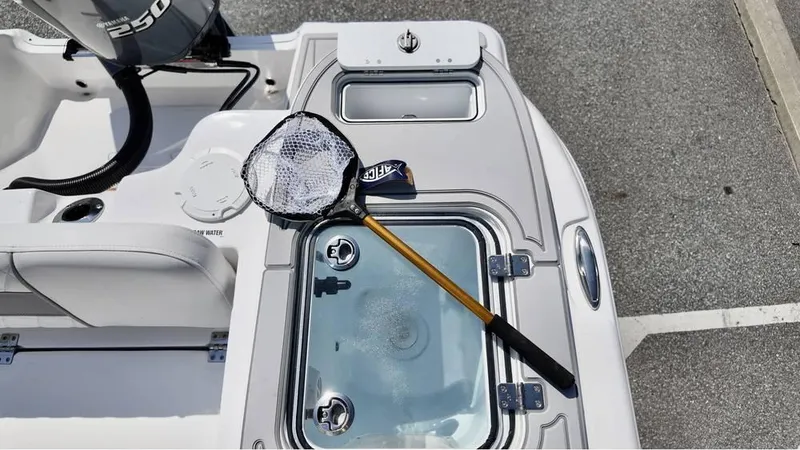 Slide: The Image of 2025 Sea Fox 248 Commander boat deck with fishing net and livewell. - 13