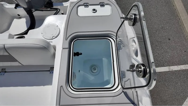 Slide: The Image of 2025 Sea Fox 248 Commander boat with open storage compartment, showcasing sleek design and functionality. - 14