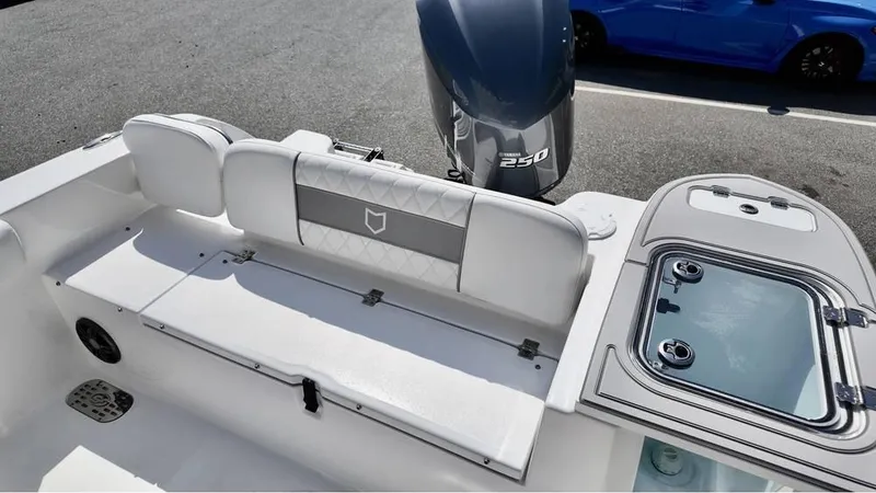 Slide: The Image of 2025 Sea Fox 248 Commander boat interior with seating and engine view. - 16